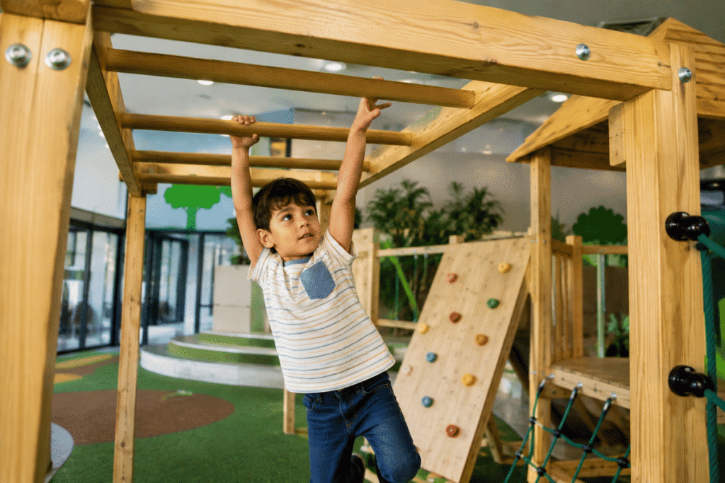Why Monkey Bars Are Great for Kids' Development 2 Boy Swinging on Wooden Monkey Bars